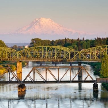 The Puyallup River meanders down from the glaciers on Mount Rainier under bridges through cities on it's way to Puget Sound
